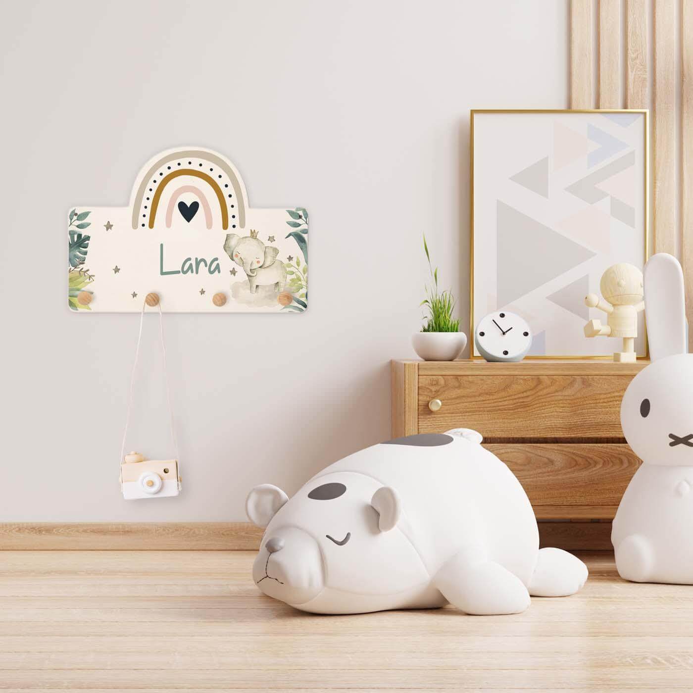 coat rack with rainbow and elephant engraving