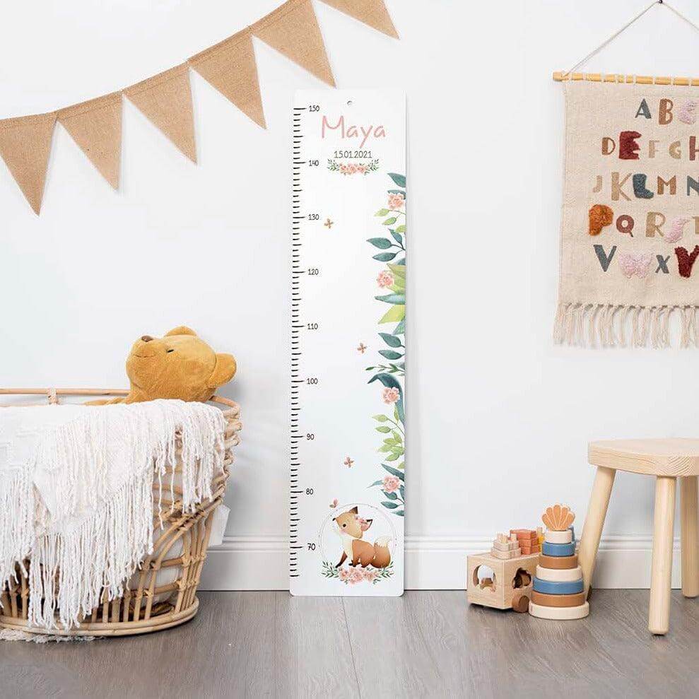 handcrafted growth chart with fox engraving